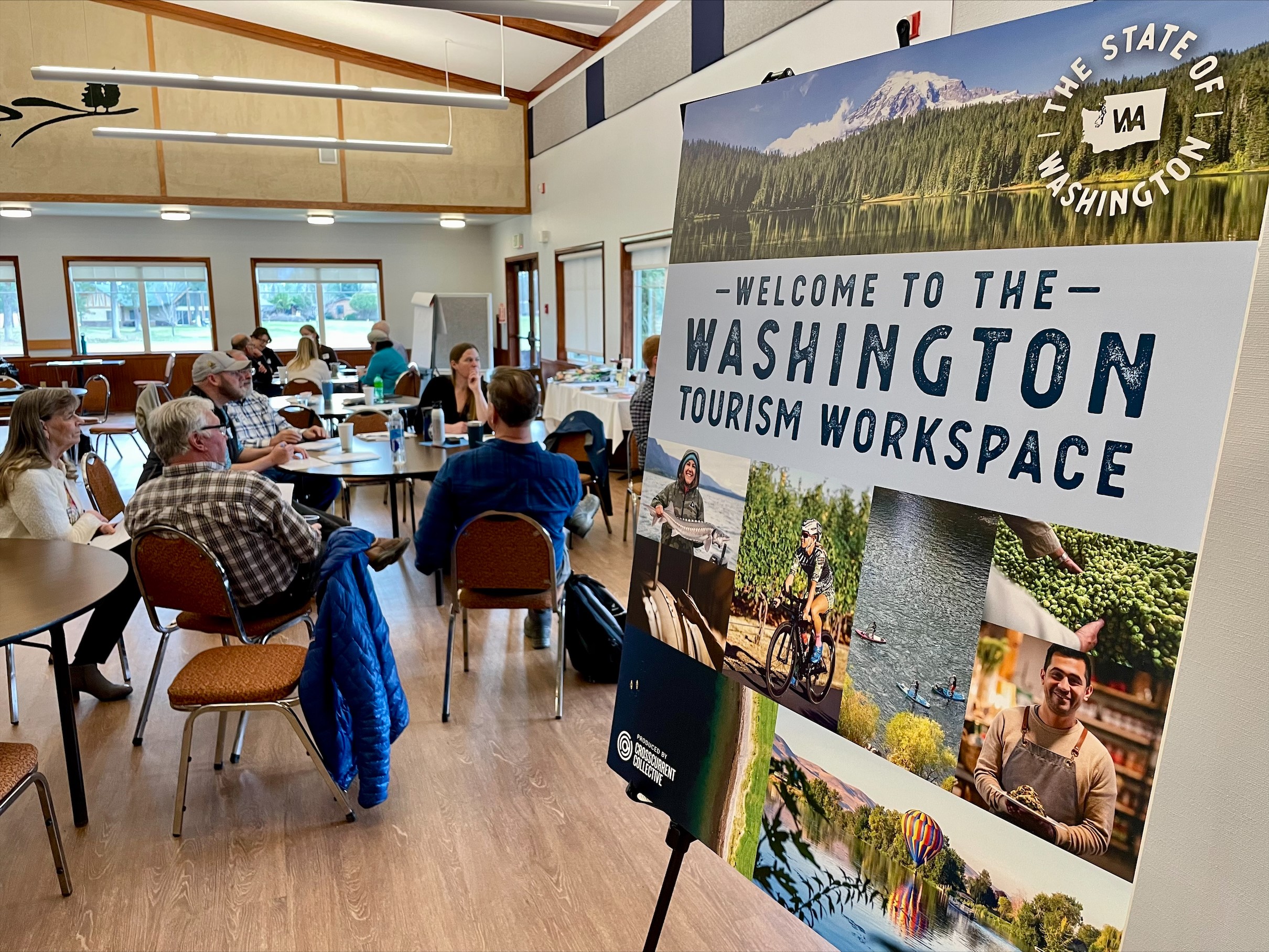 A group of people sit around tables during a Rural Tourism Support program workshop in Washington