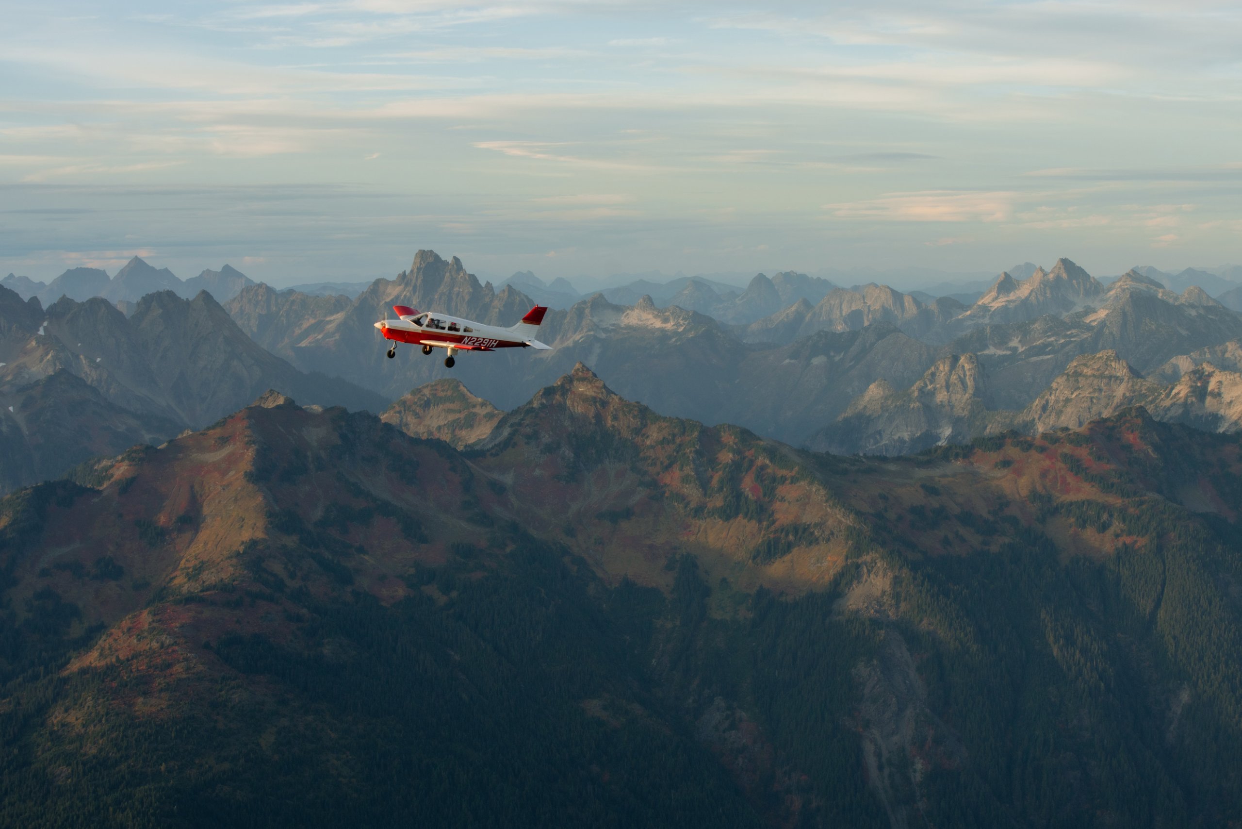 A small plane flies over North Cascades National Park